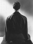 Photo from the back of a person sitting zazen
