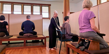 Donna-sensei helping a student with their posture
